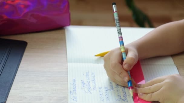 Kid girl doing homework drawing. selective focus. — Stock Video