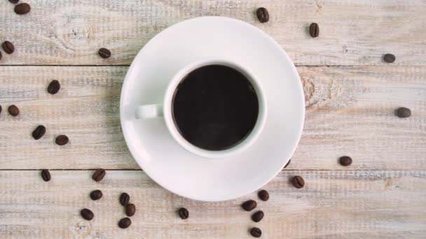 Coffee in a cup on the table. selective focus. — Stock Video