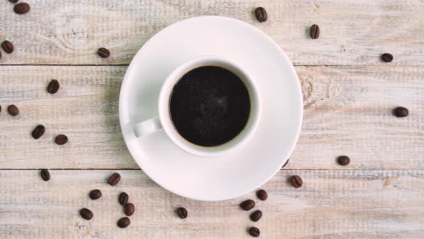 Coffee in a cup on the table. selective focus. — Stock Video