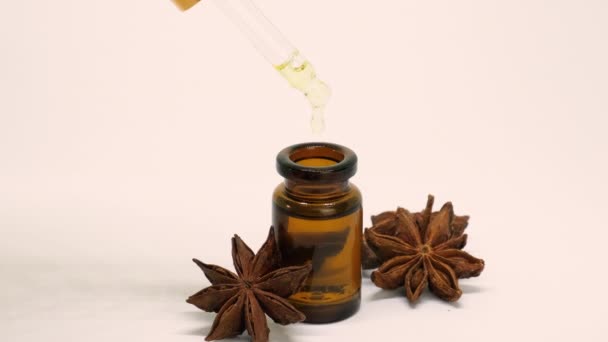 Star anise essential oil in small bottles. selective focus. — Stock Video