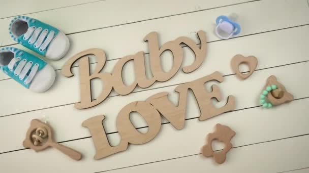 Baby accessories and the inscription baby. Selective focus. — Stock Video