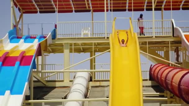 People descend from the water aquapark. selective focus. — Stock Video