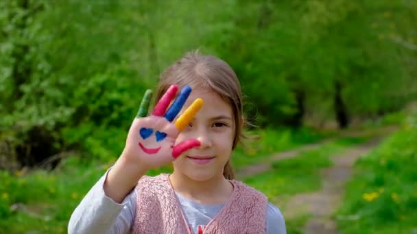 Child hand painted with paints. Selective focus. — Stock Video