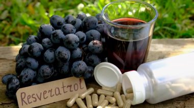 Resveratrol supplements and homeopathy. Selective focus. food.