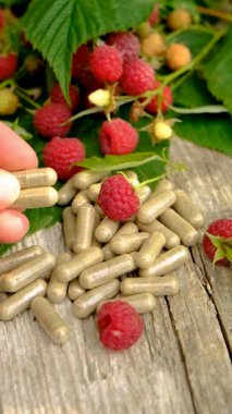 Raspberry leaf extract and supplements. Selective focus. Food.
