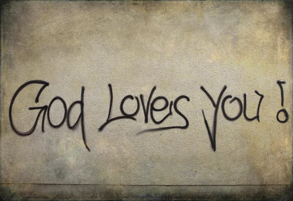 Graffiti: ¡Dios te ama! en una pared — Foto de Stock