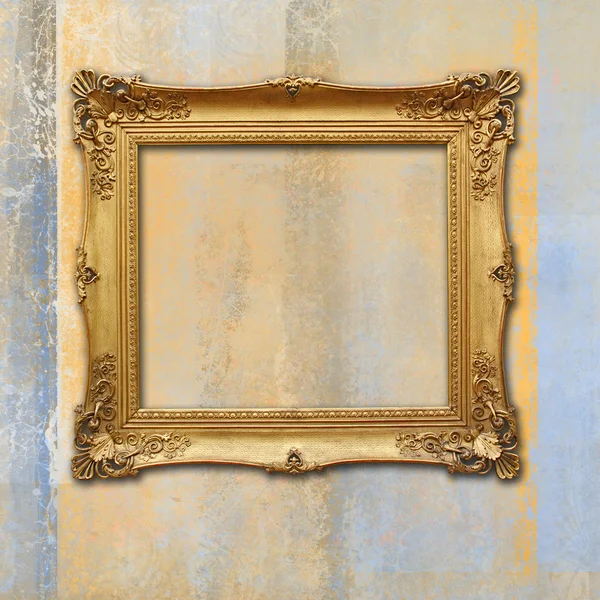 Baroque golden frame on a grunge faded texture — Stock Photo, Image