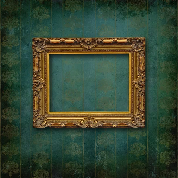 Wood carved old baroque frame on Victorian wallpaper — Stock Photo, Image