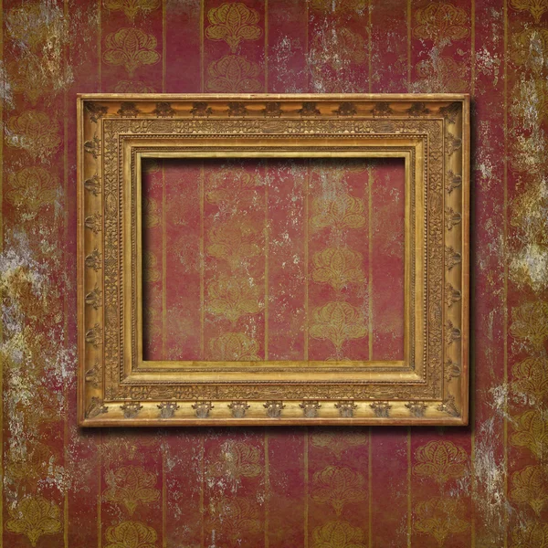 Golden frame on burgundy grunge wallpaper — Stock Photo, Image