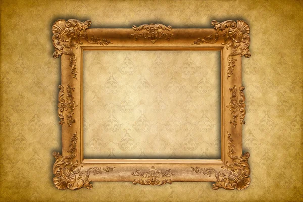 Gold baroque frame on a golden damask Victorian wallpaper — Stock Photo, Image