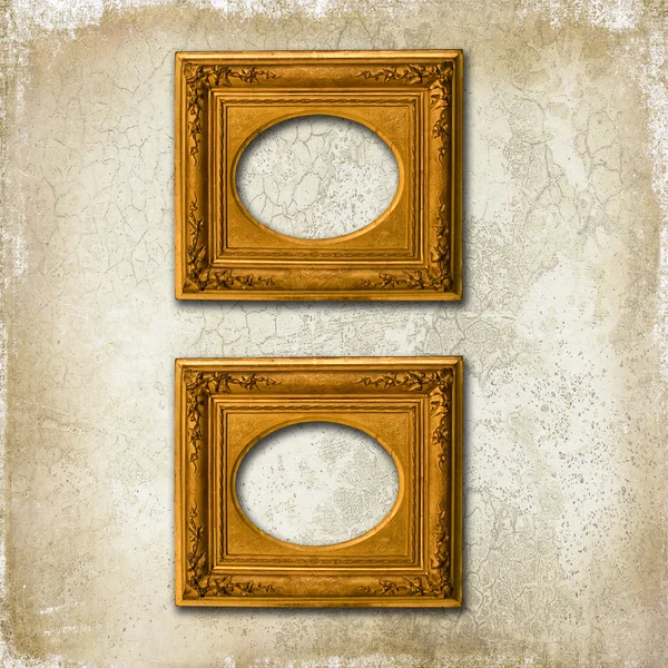 Two golden frames on a grunge wall — Stock Photo, Image
