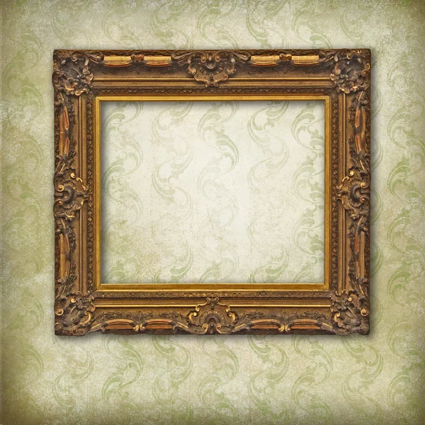 Wooden carved empty frame on faded stylized texture — Stock Photo, Image