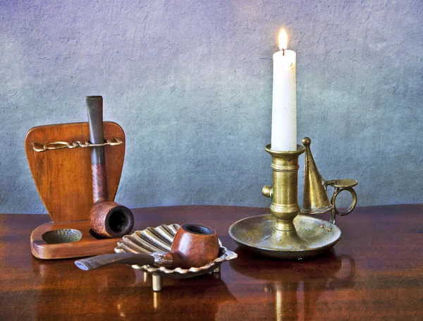 Old pipes and candle — Stock Photo, Image