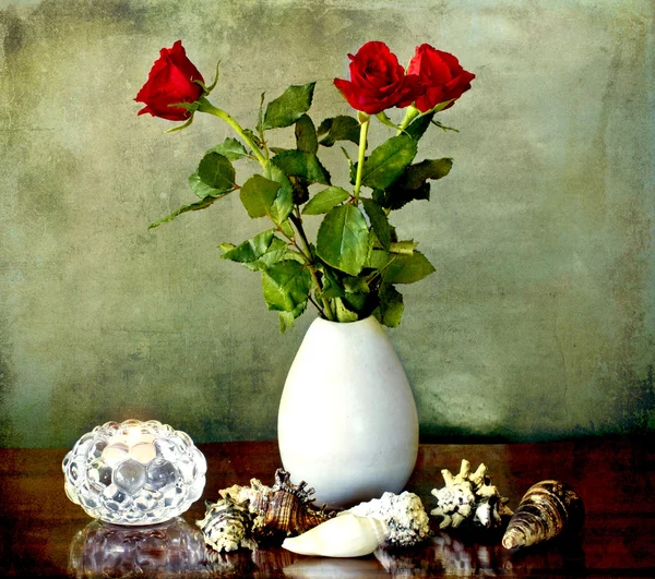 Still llife with red roses candle and shells — Stock Photo, Image