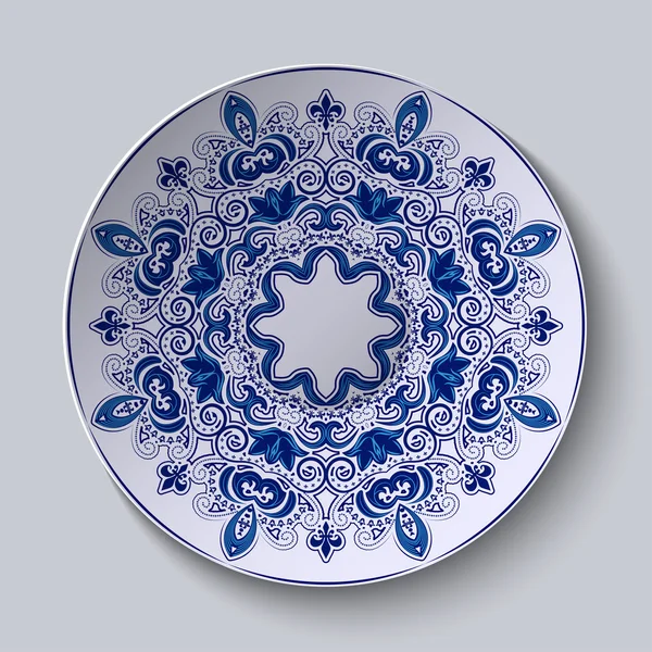 Blauer Zierschmuck. Muster wird auf eine Keramikplatte aufgetragen. — Stockvektor