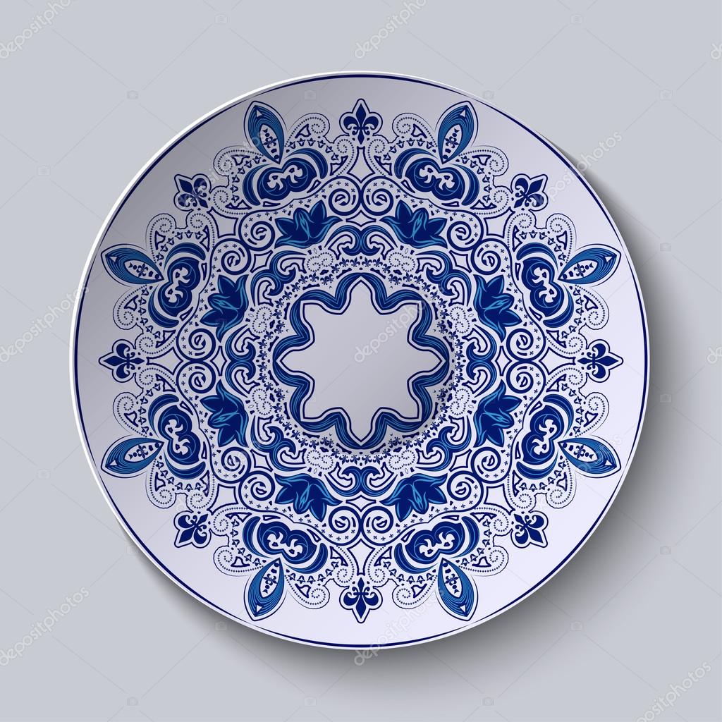 Blue decorative Pattern is applied on a ceramic plate