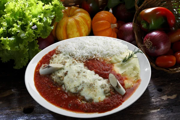 The steak parmigiana with potato and rice — Stock Photo, Image