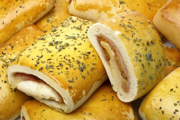 Rolled bun with cheese and vegetables — Stock fotografie