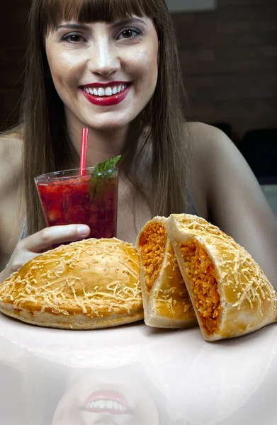 Young woman enjoying strawberry cocktail — Stock Photo, Image