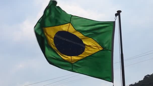 Bandera de Brasil con el Cristo Redentor — Vídeos de Stock