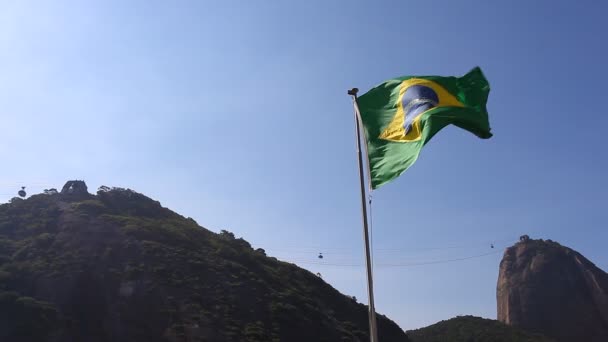 Bandera de Brasil con el Cristo Redentor — Vídeos de Stock