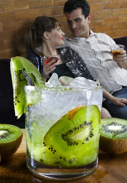 Couple in restaurant with cocktails — Stock Photo, Image