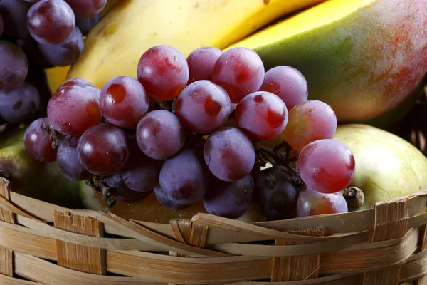 Fruit basket on the farm with grape, mango, banana. — Stock Photo, Image