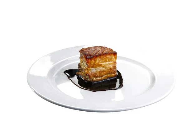 Roast pork belly on a white plate — Stock Image Roast pork belly on a white plate Stock Image