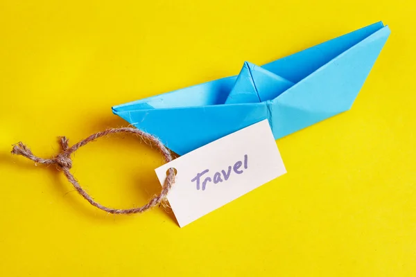 Paper Boat with a sign Travel - travel concept — Stock Photo, Image