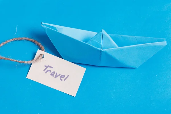 Paper Boat with a sign Travel - travel concept — Stock Photo, Image