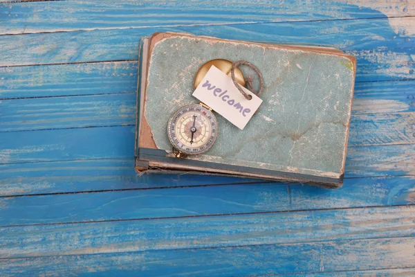 Bienvenida - signo en el libro vintage — Foto de Stock