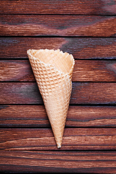 Empty Waffle cone on wooden table