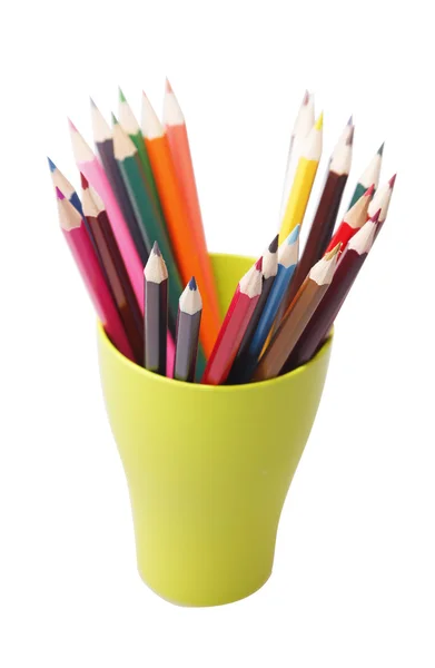 Colored pencils in a green glass — Stock Photo, Image