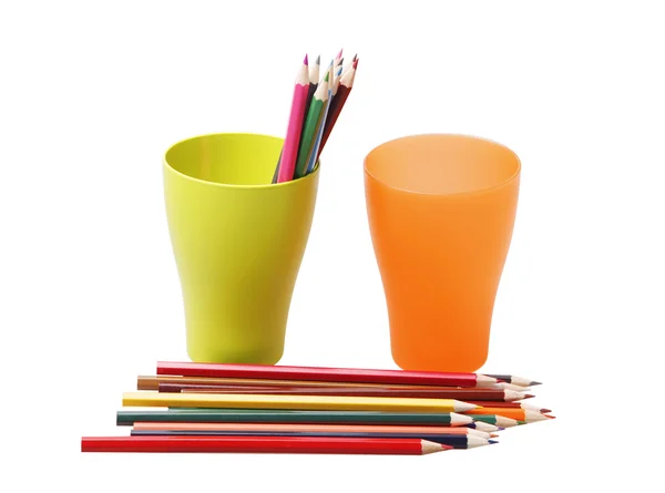 Colored pencils in a green and orange glasses — Stock Photo, Image