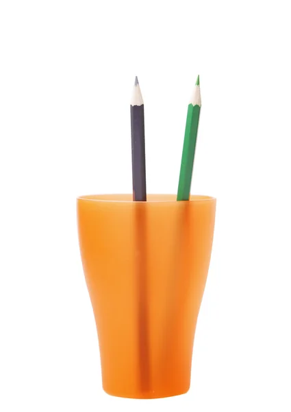 Crayons de couleur dans un verre orange — Photo