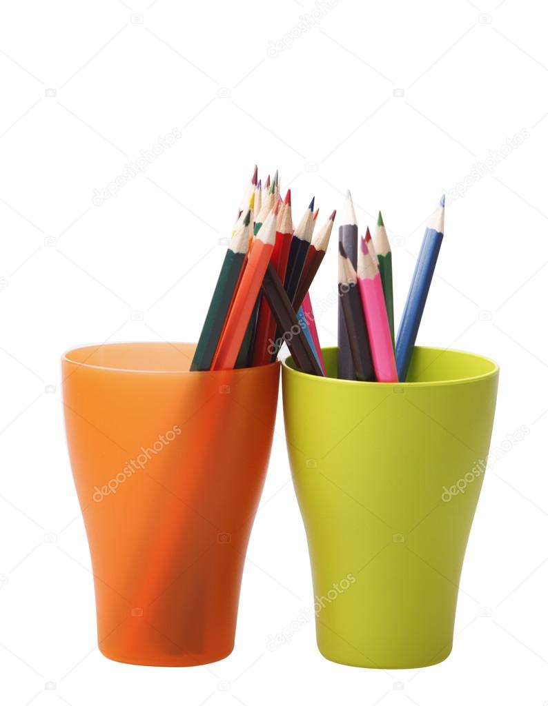 Colored pencils in a green and orange glasses