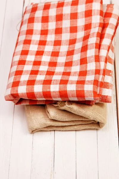 Burlap and cloth in the box on a white table — Stock Photo, Image