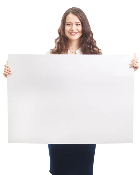 Happy businesswoman holding a white banner and smiling — Stock Photo, Image