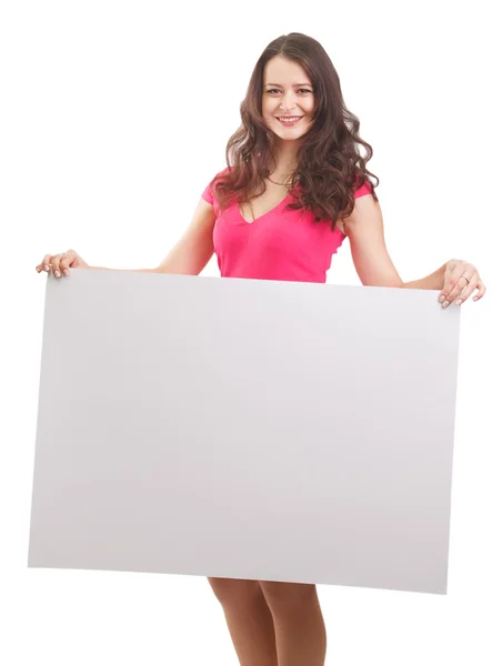 Happy businesswoman holding a white banner and smiling — Stock Photo, Image