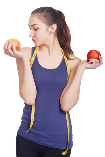 Beautiful girl holding apples in two hands — Stock Photo, Image