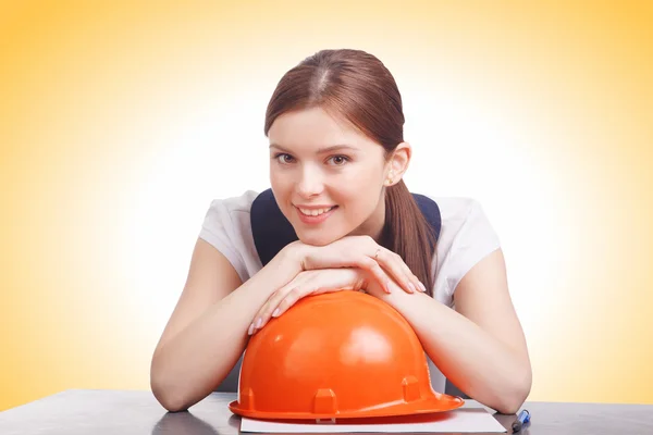 Smart young business woman with hard helmet — Stock Photo, Image