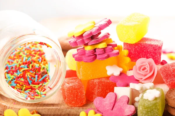 Sweets and candies on a wooden table — Stock Photo, Image