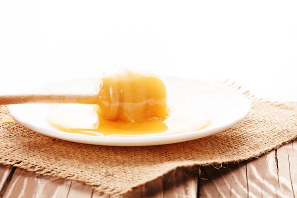 Honey is dripping from the spoon — Stock Photo, Image