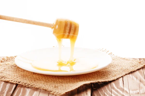 Honey is dripping from the spoon — Stock Photo, Image