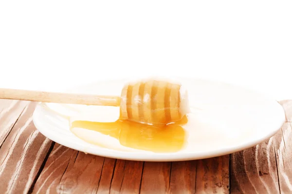 Honey is dripping from the spoon — Stock Photo, Image