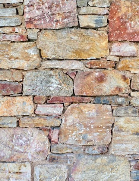 Colorato muro di pietra primo piano — Foto Stock