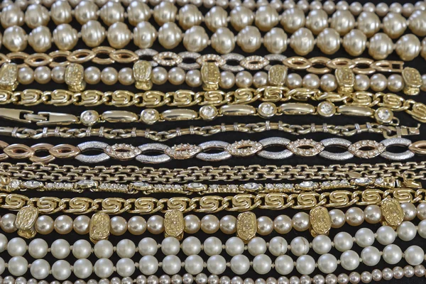 Golden jewelery closeup, strong bokeh — Stock Photo, Image