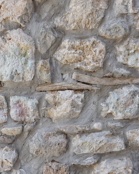 Kamień murowy ze starego drewna gałązka — Zdjęcie stockowe