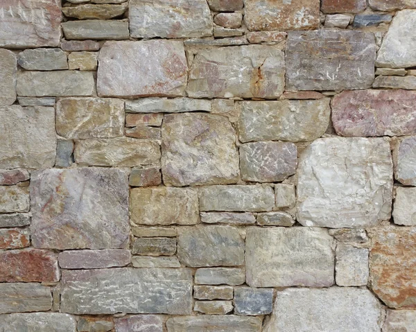 Барвиста кам'яна стіна крупним планом — стокове фото