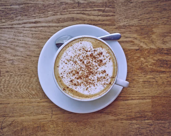 Cappuccino coffee in white cup closeup — Stock Photo, Image